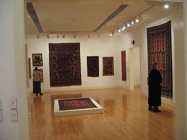 Installation photo of Afghan rugs shown at the art gallery at Davidson College